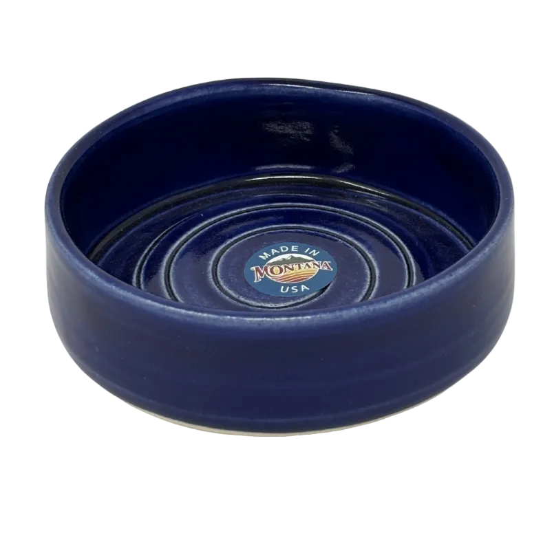 Blue ceramic bowl with 'Made in Montana USA' label on a white background