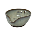 Ceramic bowl with a textured surface on a white background