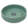 Green ceramic bowl with 'Made in Montana USA' label on a white background